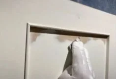 reat cabinet surfaces before painting Sanding cabinet door surface to prepare for painting and ensure smooth adhesion